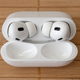 The Apple AirPods Pro 2nd Generation in their charging case with the lid open.